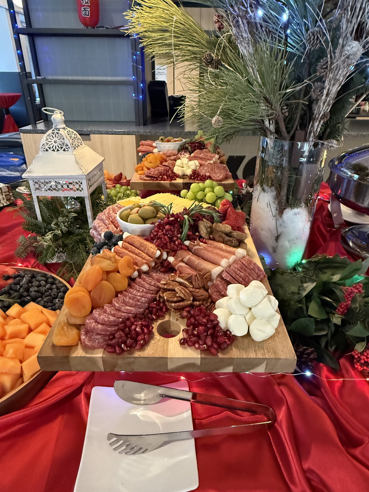 Lavish charcuterie and grazing board with cured meats, cheeses, and fresh fruit